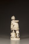 A JAPANESE IVORY OKIMONO OF A MAN REPAIRING HIS SANDAL,MEIJI PERIOD (1868-1912)