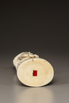 A JAPANESE IVORY OKIMONO OF A MAN REPAIRING HIS SANDAL,MEIJI PERIOD (1868-1912)