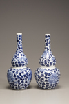 A pair of blue and white double gourd vases