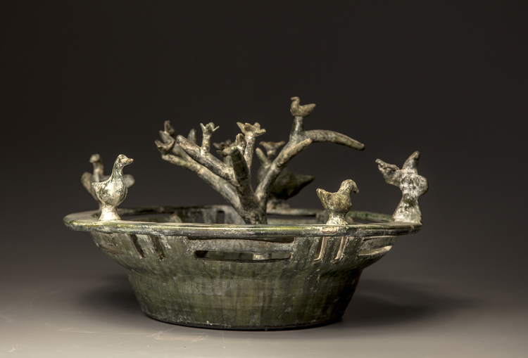 A green-glazed pottery duck pond