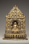 A gilt bronze Jain Tirthankara with silver inlay