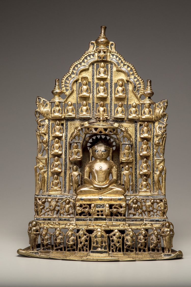 A gilt bronze Jain Tirthankara with silver inlay
