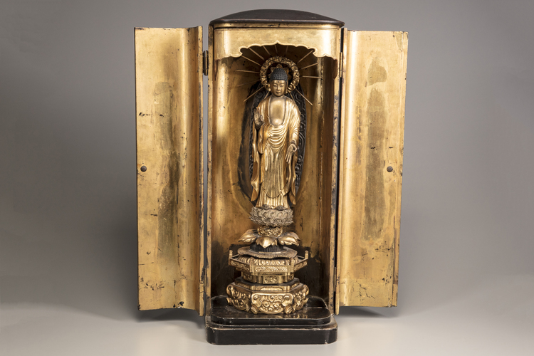 A large Japanese gilt wood figure of Amida Nyorai with zushi