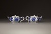 A pair of blue and white hexagonal teapots