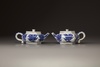 A pair of blue and white hexagonal teapots