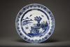 A blue and white charger and a blue and white dish