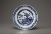 A blue and white charger and a blue and white dish