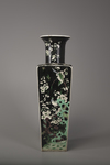 A famille noir square-section vase