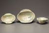 Three green glazed pottery ear cups
