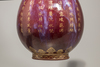 A flambé glazed gilt-inscribed bottle vase