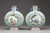 A matched pair of Chinese turquoise-ground famille rose moonflasks