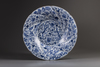 A large Chinese blue and white spiral moulded dish