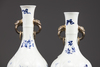 Two similar moulded Chinese blue and white twin-handled vases