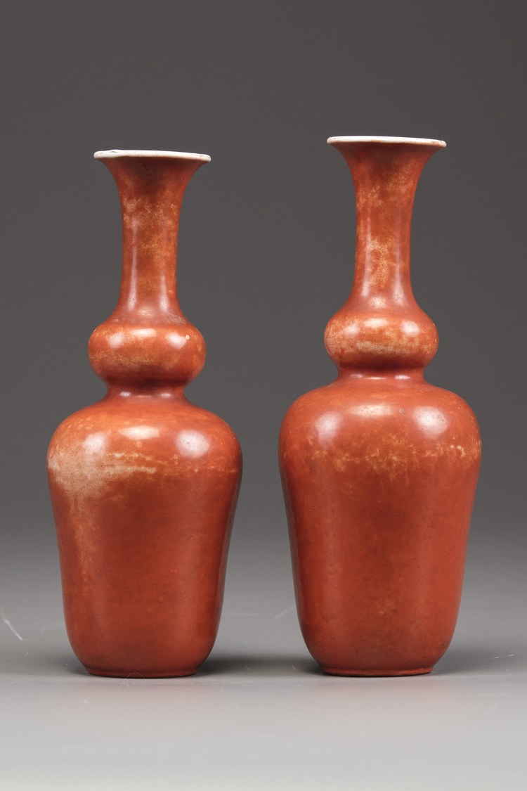 A matched pair of Chinese coral red-decorated double gourd vases
