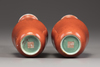 A matched pair of Chinese coral red-decorated double gourd vases