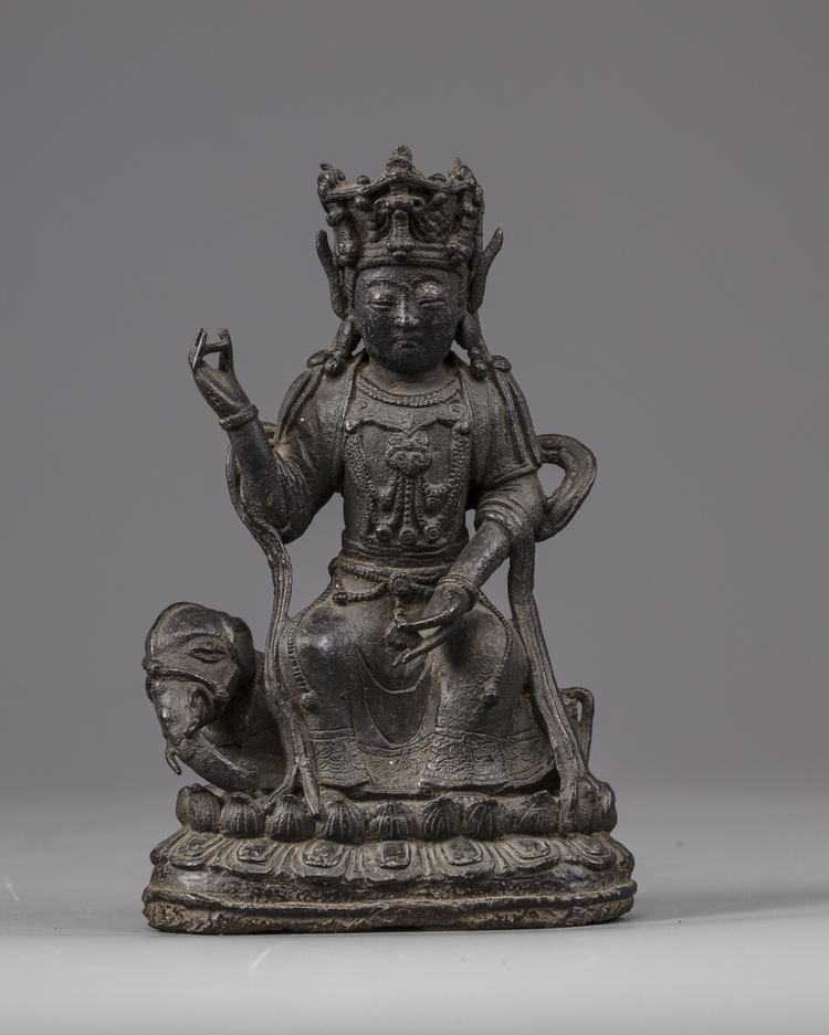 A Chinese Ming-style bronze figure of Guanyin seated on an elephant