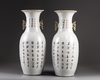 A pair of Chinese iron-red decorated 'Buddhist lion' vases