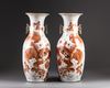 A pair of Chinese iron-red decorated 'Buddhist lion' vases