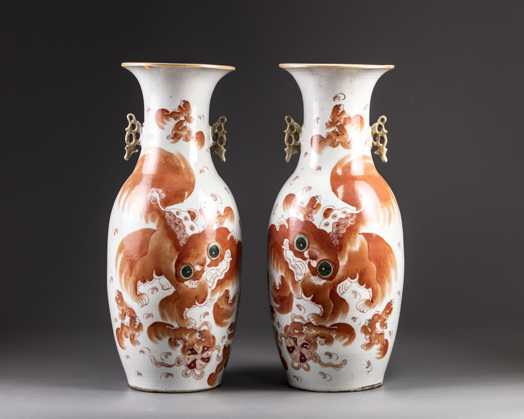 A pair of Chinese iron-red decorated 'Buddhist lion' vases