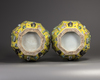 A pair of Chinese yellow-ground appliqué-decorated octagonal vases