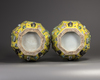 A pair of Chinese yellow-ground appliqué-decorated octagonal vases