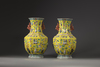 A pair of Chinese yellow-ground appliqué-decorated octagonal vases