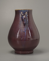 A Chinese flambé-glazed deer-handled vase. Hu
