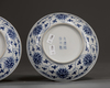 A pair of Chinese blue and white 'lotus' dishes