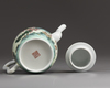 A Chinese famille rose teapot and cover