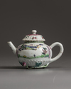A small Chinese famille rose moulded teapot and cover