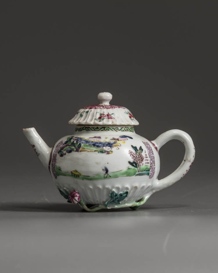 A small Chinese famille rose moulded teapot and cover