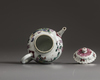 A small Chinese famille rose moulded teapot and cover