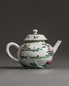 A small Chinese famille rose moulded teapot and cover