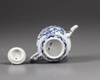 A small Chinese blue and white teapot and cover
