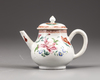 A Chinese famille rose teapot and cover