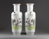 A pair of Chinese famille rose rouleau vases