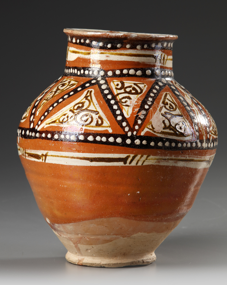A SAMANID SLIP-PAINTED POTTERY JAR, 10TH-11TH CENTURY