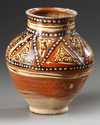 A SAMANID SLIP-PAINTED POTTERY JAR, 10TH-11TH CENTURY