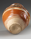 A SAMANID SLIP-PAINTED POTTERY JAR, 10TH-11TH CENTURY