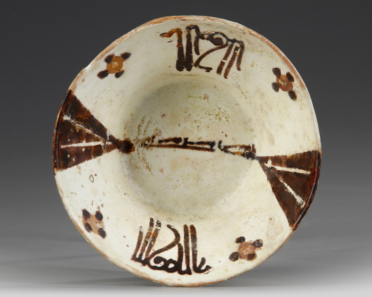 A SAMANID SLIP PAINTED POTTERY BOWL, EAST PERSIA OR TRANSOXIANA, 9TH-10TH CENTURY