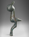 A BRONZE FINIAL IN THE FORM OF HARE, POSSIBLY FATIMID, 11TH-13TH CENTURY