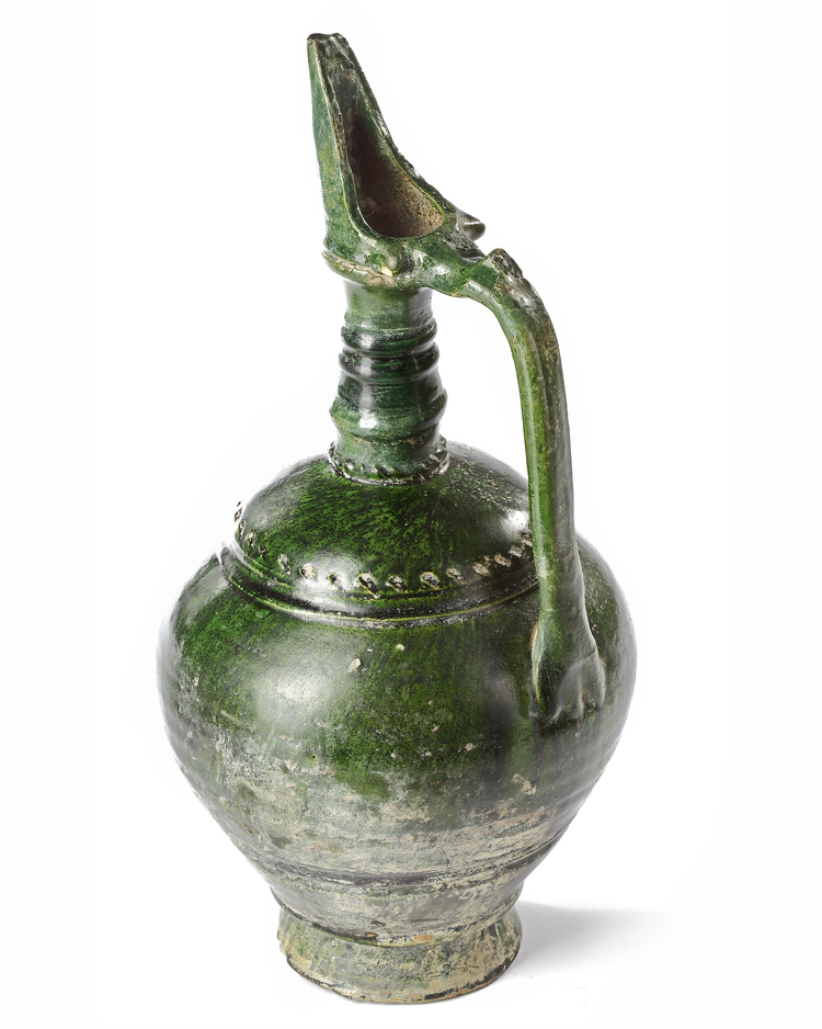 AN UMAYYAD GREEN GLAZED POTTERY JUG, EASTERN MEDITERRANEAN, 8TH-9TH CENTURY