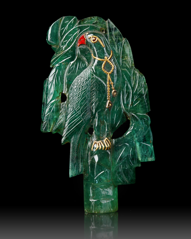 A  MUGHAL CARVED EMERALD DEPICTING A PARROT IN A TREE, 19TH CENTURY