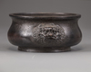 A Chinese bronze twin-lion handled censer