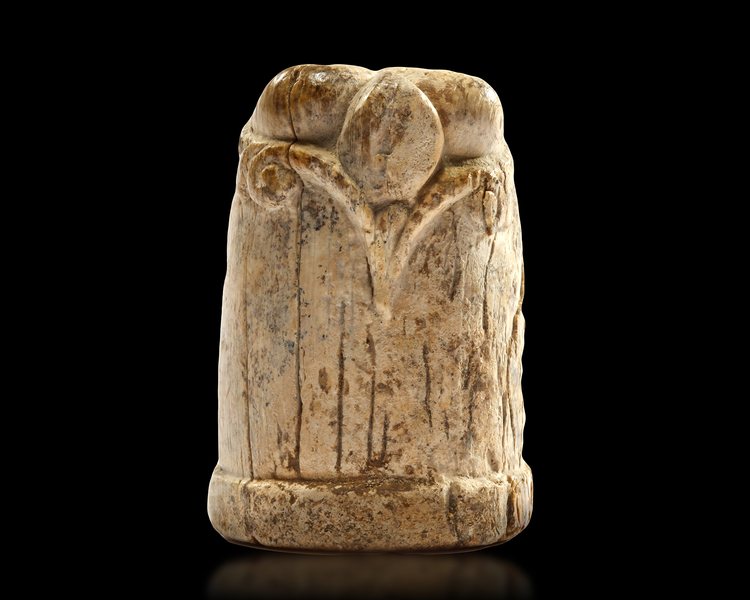 A CARVED IVORY CHESS PIECE, EGYPT OR IRAQ, 10TH-11TH CENTURY