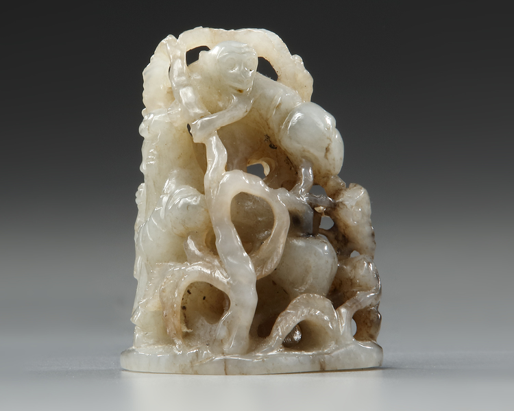 A CHINESE GREYISH CELADON JADE ‘LONGEVITY’ HAT FINIAL, YUAN DYNASTY (1271-1368)