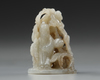 A CHINESE GREYISH CELADON JADE ‘LONGEVITY’ HAT FINIAL, YUAN DYNASTY (1271-1368)