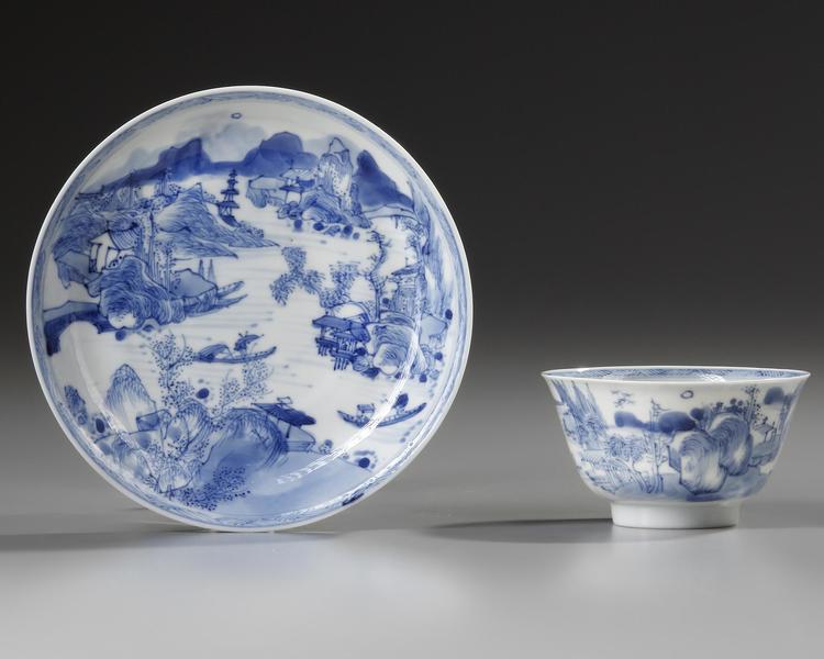 A CHINESE BLUE AND WHITE 'MASTER OF THE ROCKS' CUP AND SAUCER, KANGXI (1662-1722)