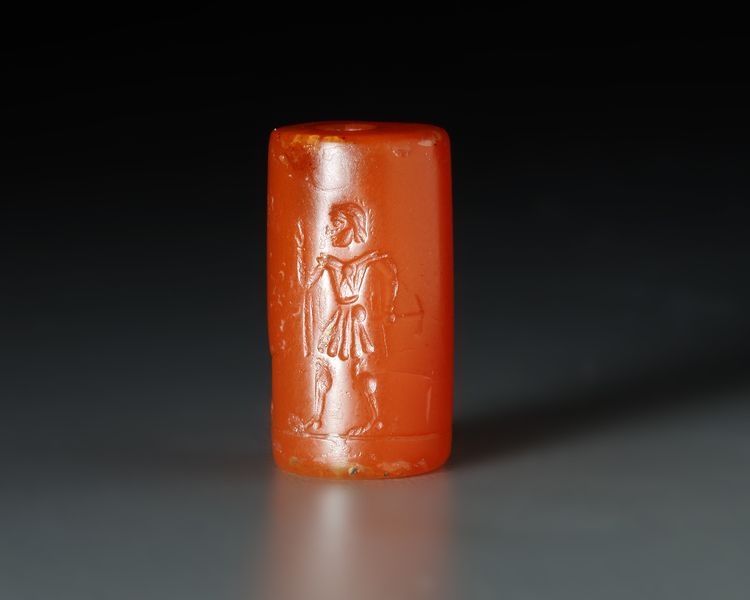 A GRECO PERSIAN AGATE CYLINDER SEAL WITH A MAN AND WINGED BULL, CIRCA 520-440 B.C.