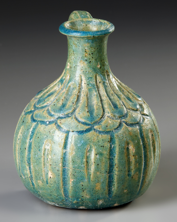 A Turquoise Blue Glazed Pottery Jug Kashan 12th Century Persia